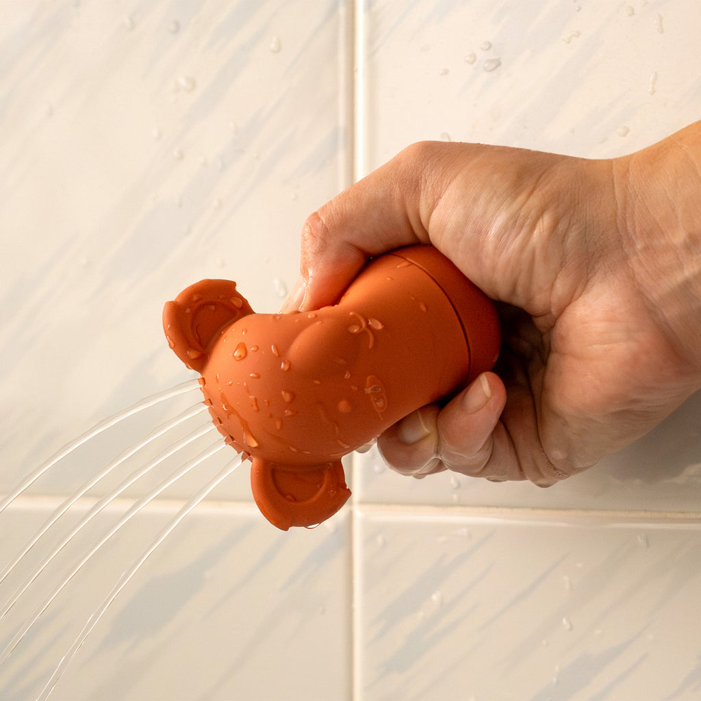Toddler bath toy made from high quality silicon. Montessori style, Aussie animal bath toys. Water pouring example.