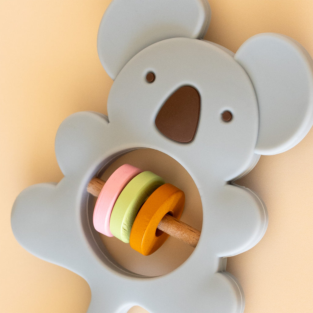 A baby rattle toy shaped like a koala, close up view