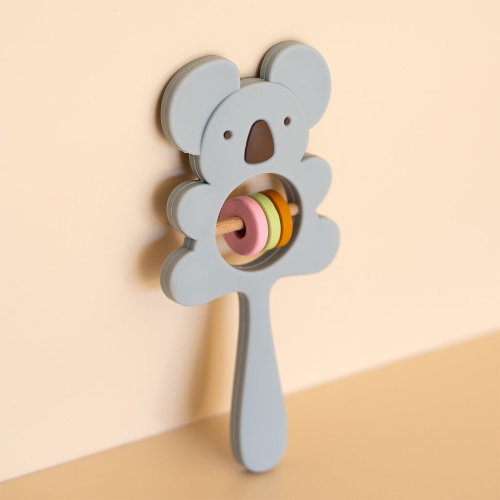 A baby rattle toy shaped like a koala, front view