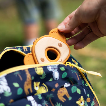 A baby teether like a koalas head, bamboo and silicon, inside kids backpack view