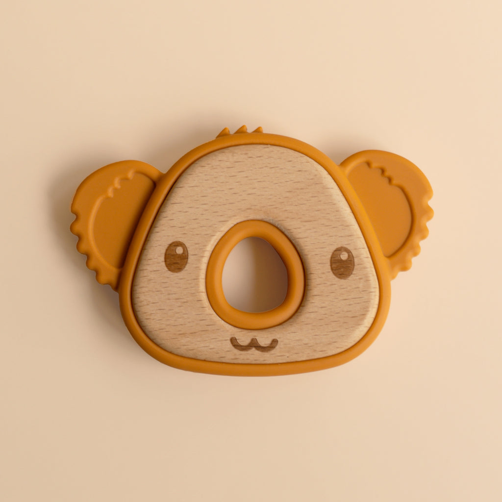 A baby teether like a koalas head, bamboo and silicon, front view