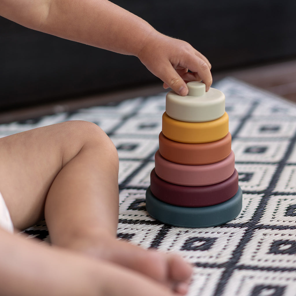 Silicon stacker wide discs toy for toddlers, kids plays on mat view
