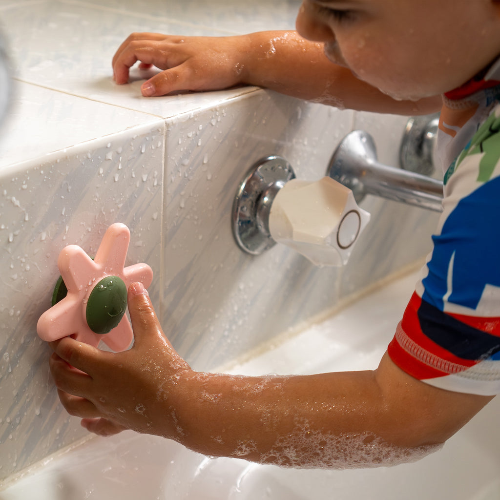 A toddler kids toy for bath time, kid playing view